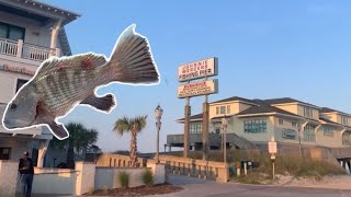 What big fish are likely to bite at night from the Ocean Isle Beach pier about 70 feet from the edge near the light, and that lie on the bottom like rocks?